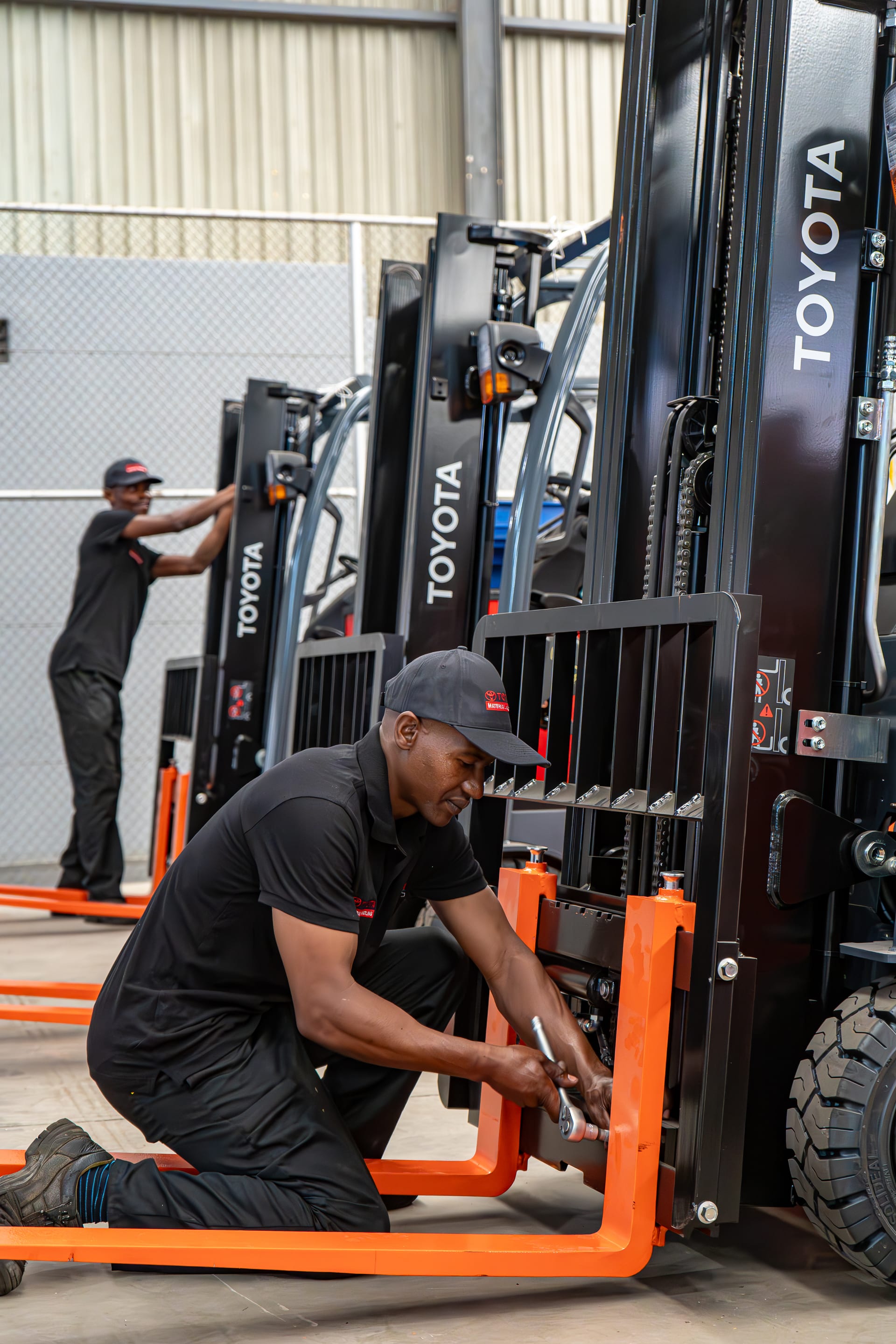 FTOFS technicians assembling new Toyota forklifts in the workshop