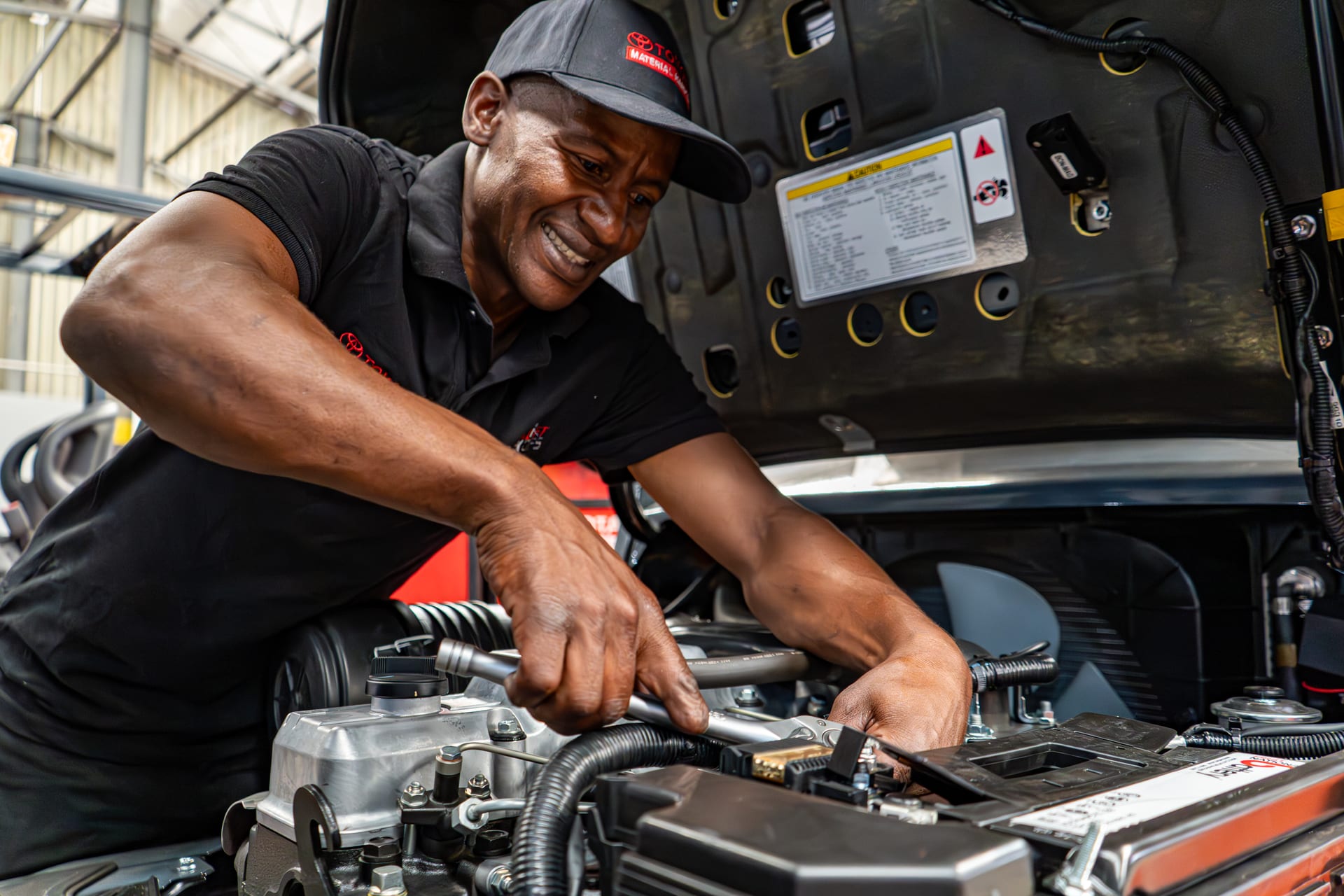FTOFS technician working on a Toyota engine